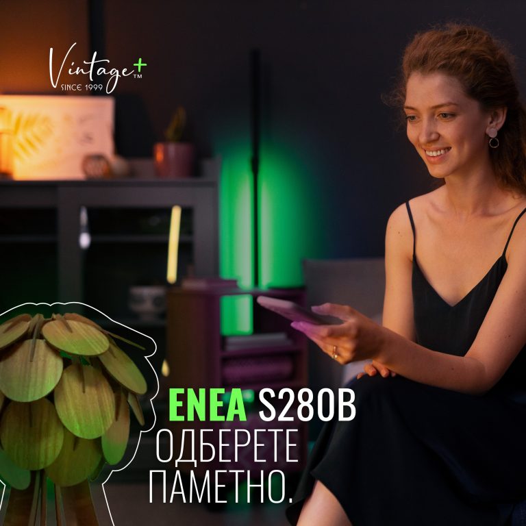 Woman smiling and holding a tablet in a cozy, modern room with soft colorful lighting and green plant.